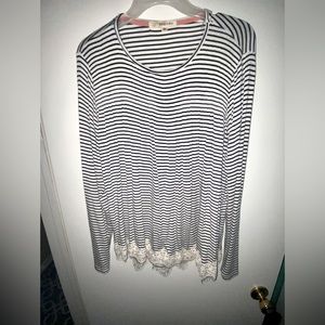 Never worn but no tags, black and white striped long sleeve blouse.